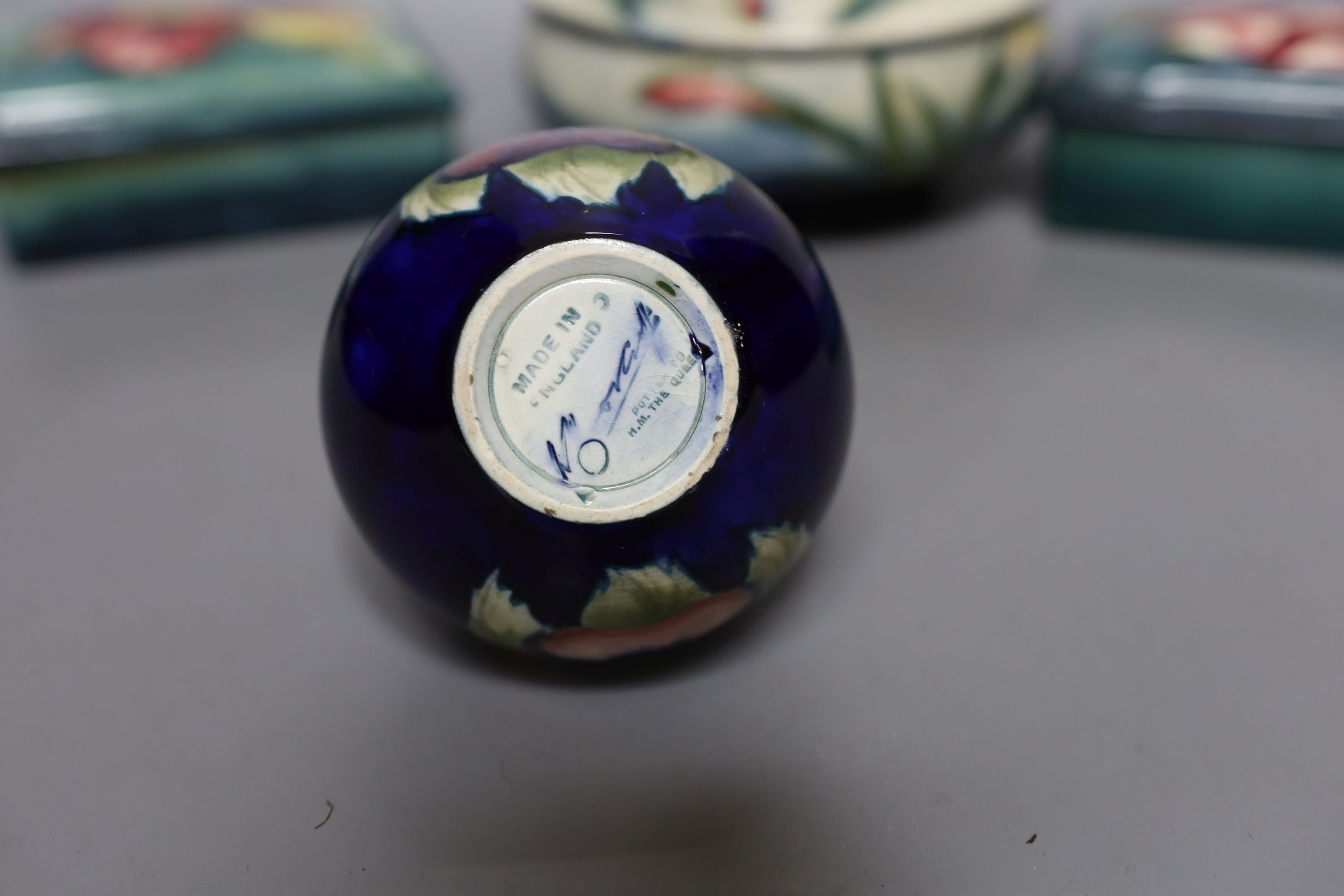 A pair of Moorcroft boxes with covers, together two other moorcroft pots (4)